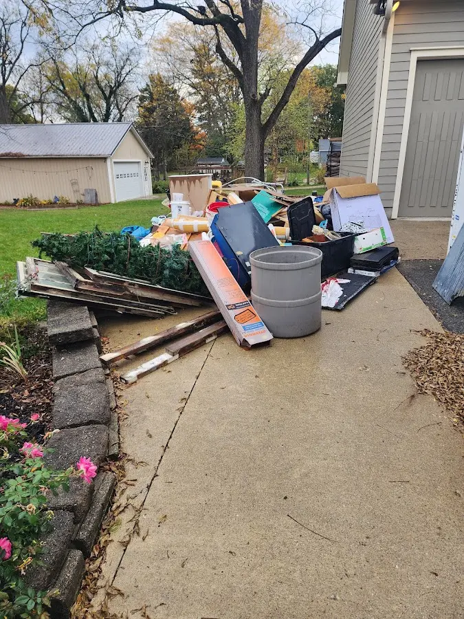 Dumpster being loaded with debris for 3 Yard Dumpster Rental in Lawrence Park